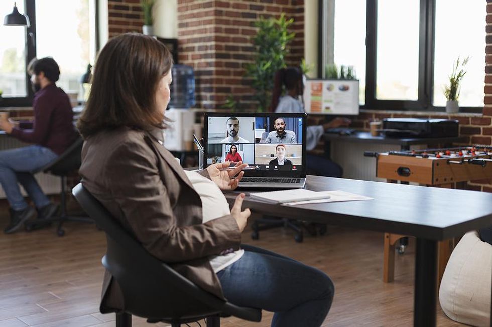 Pregnant woman joins a video meeting