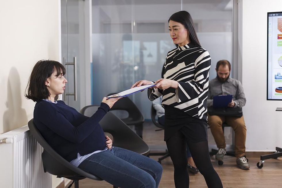 Pregnant woman waits for her job interview