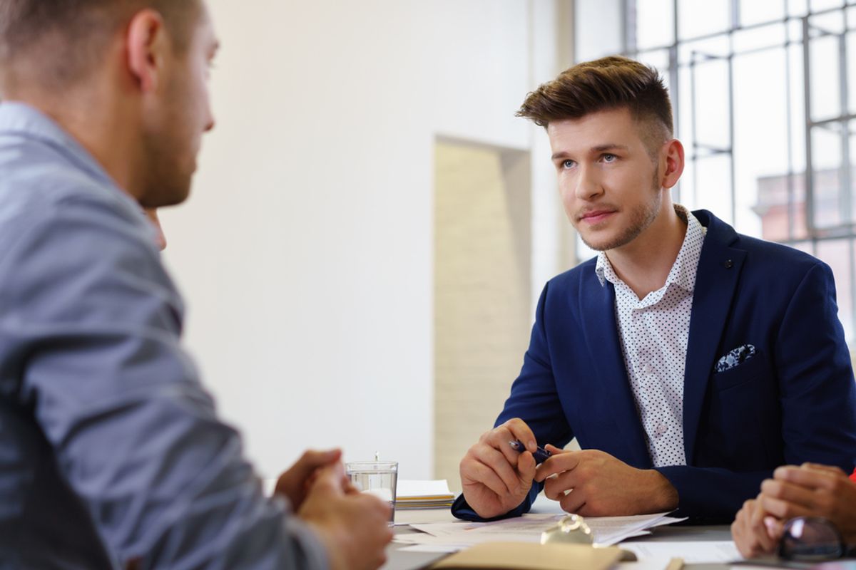 Professional man conveying three important things during his job interview