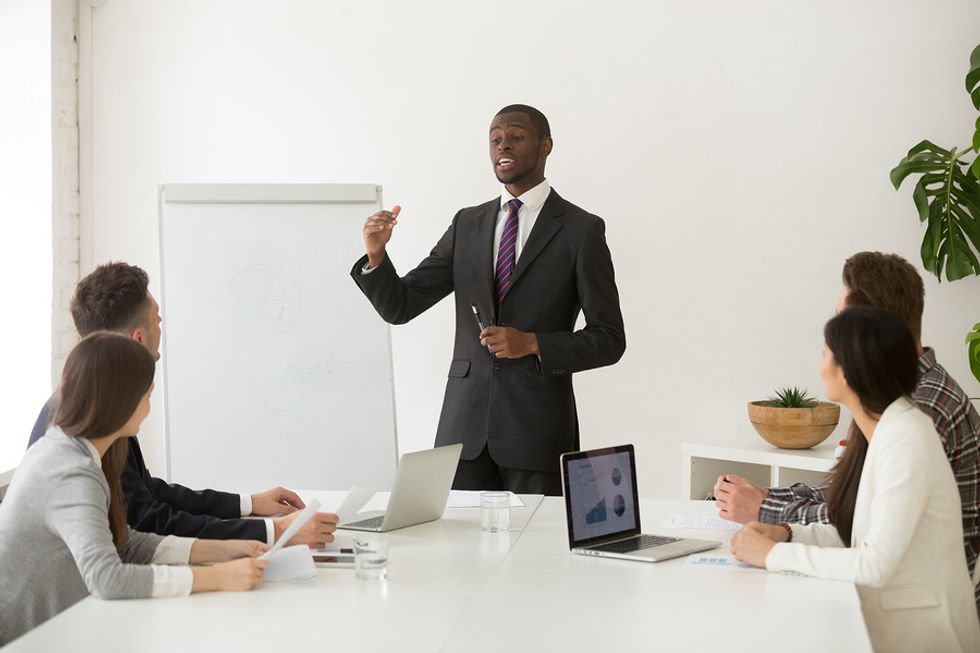 Professional man in channel sales presents to his partners