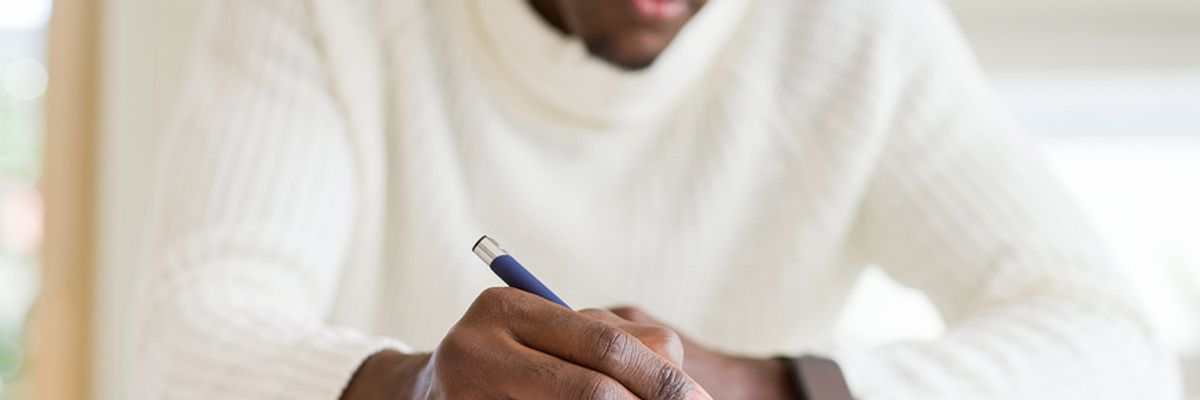 Professional man making New Year's resolutions he probably won't keep