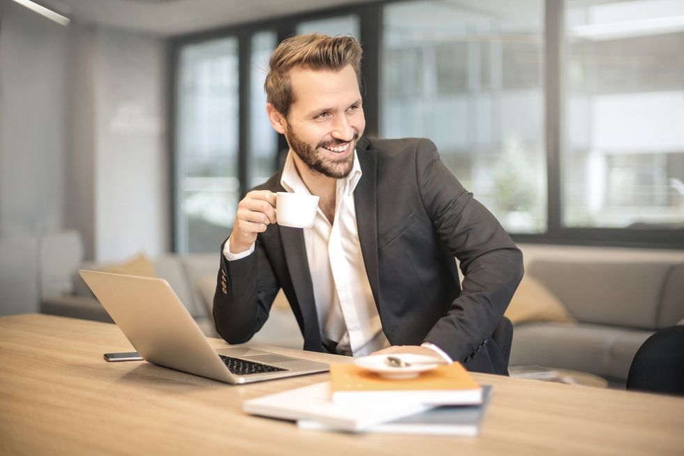 Professional man on his laptop engaging with his connections on LinkedIn