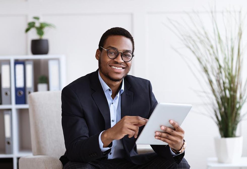 Professional man smiles at work