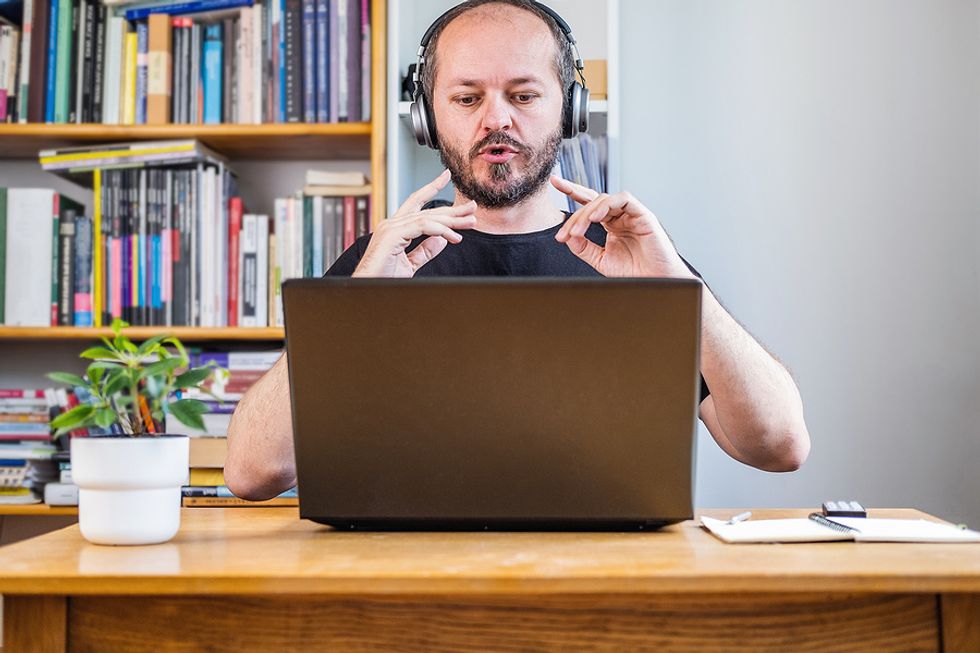 Professional man uses ice breakers during a virtual networking event