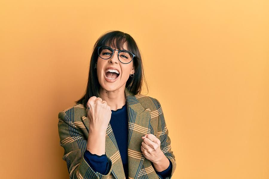 Professional woman celebrating changing careers