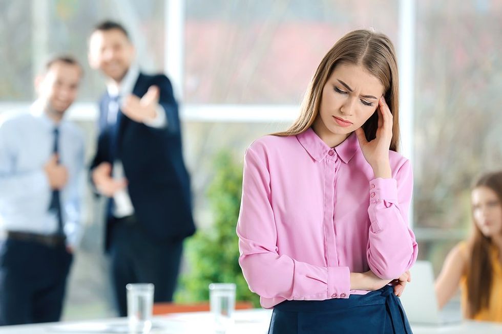 Professional woman getting bullied and can't join cliques at work