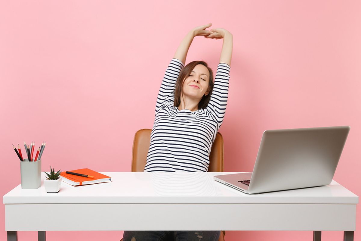 Professional woman getting ready to do some simple exercises at her desk