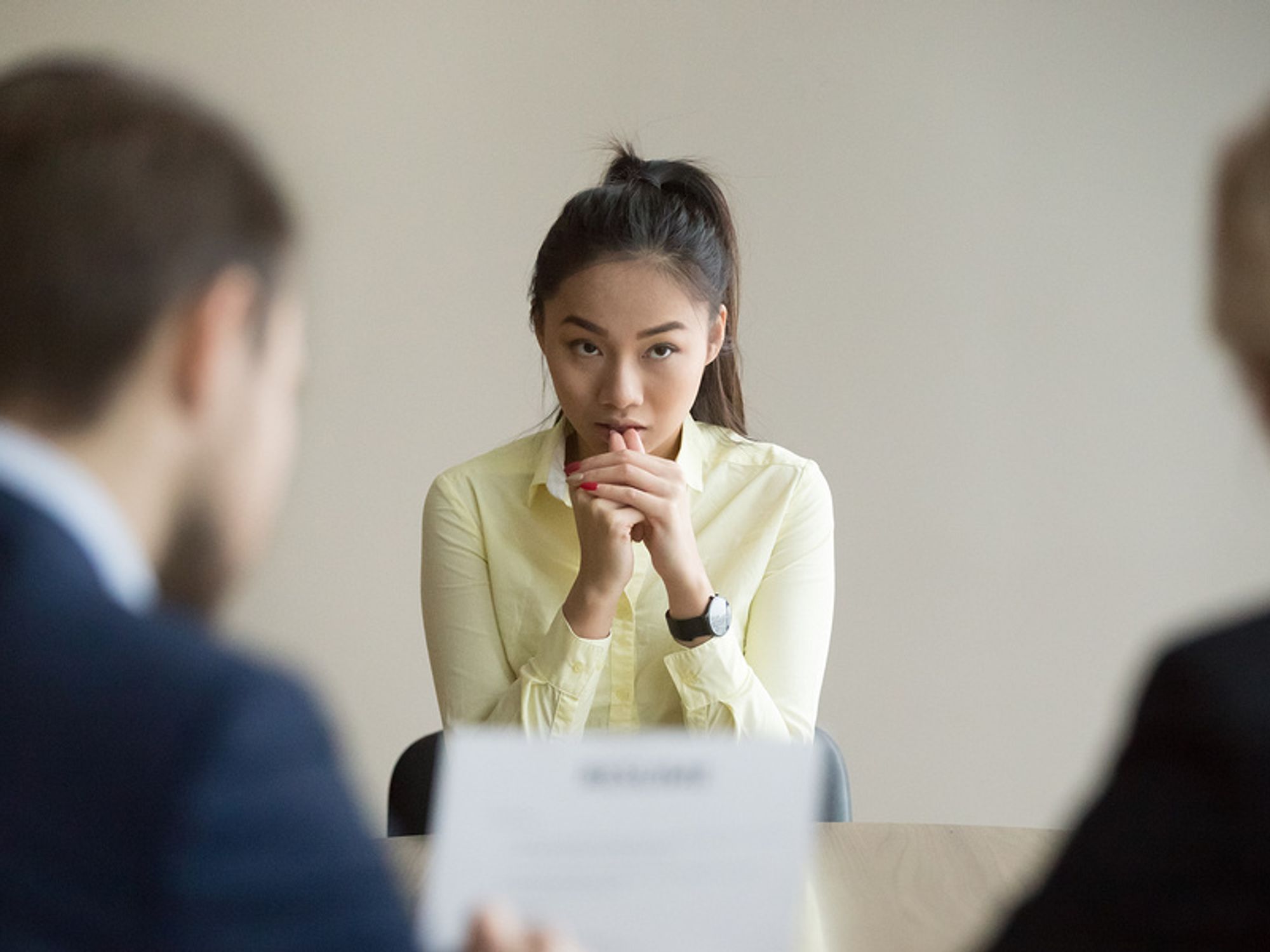 Professional woman nervous after being asked illegal interview questions