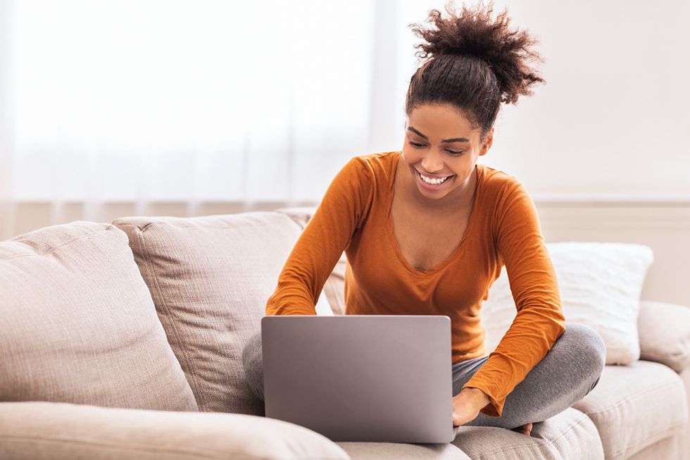 Professional woman working remotely with laptop
