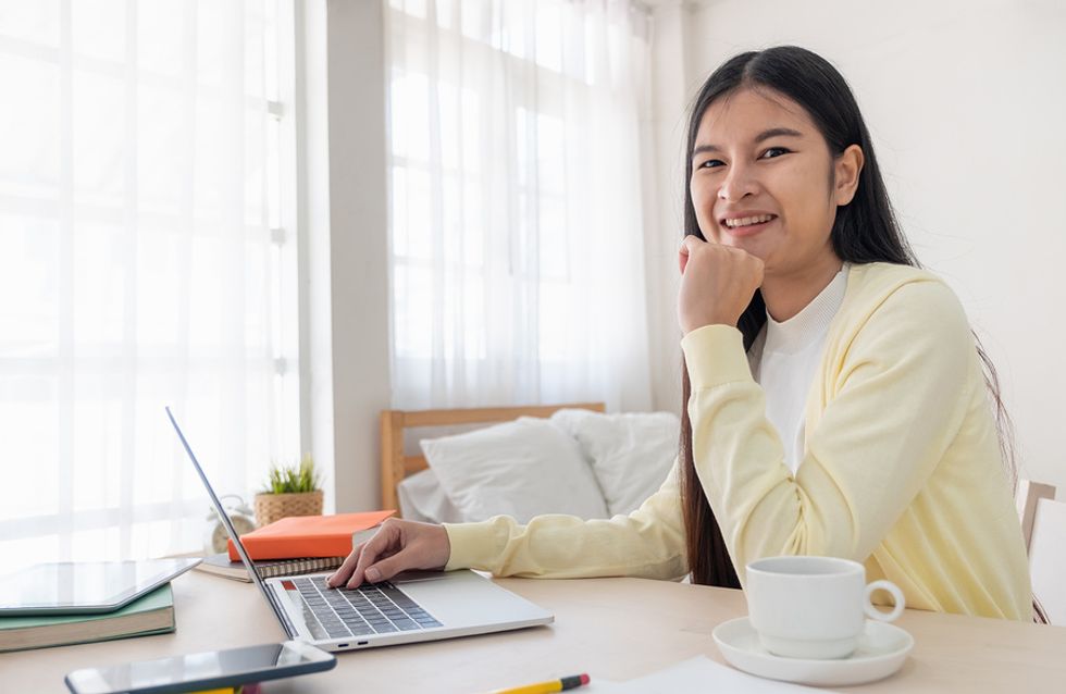 Professional woman on laptop working in her home office