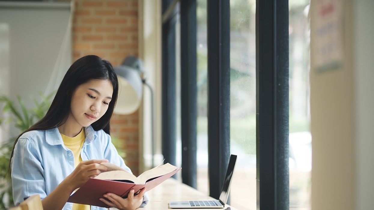 Professional woman reads a book