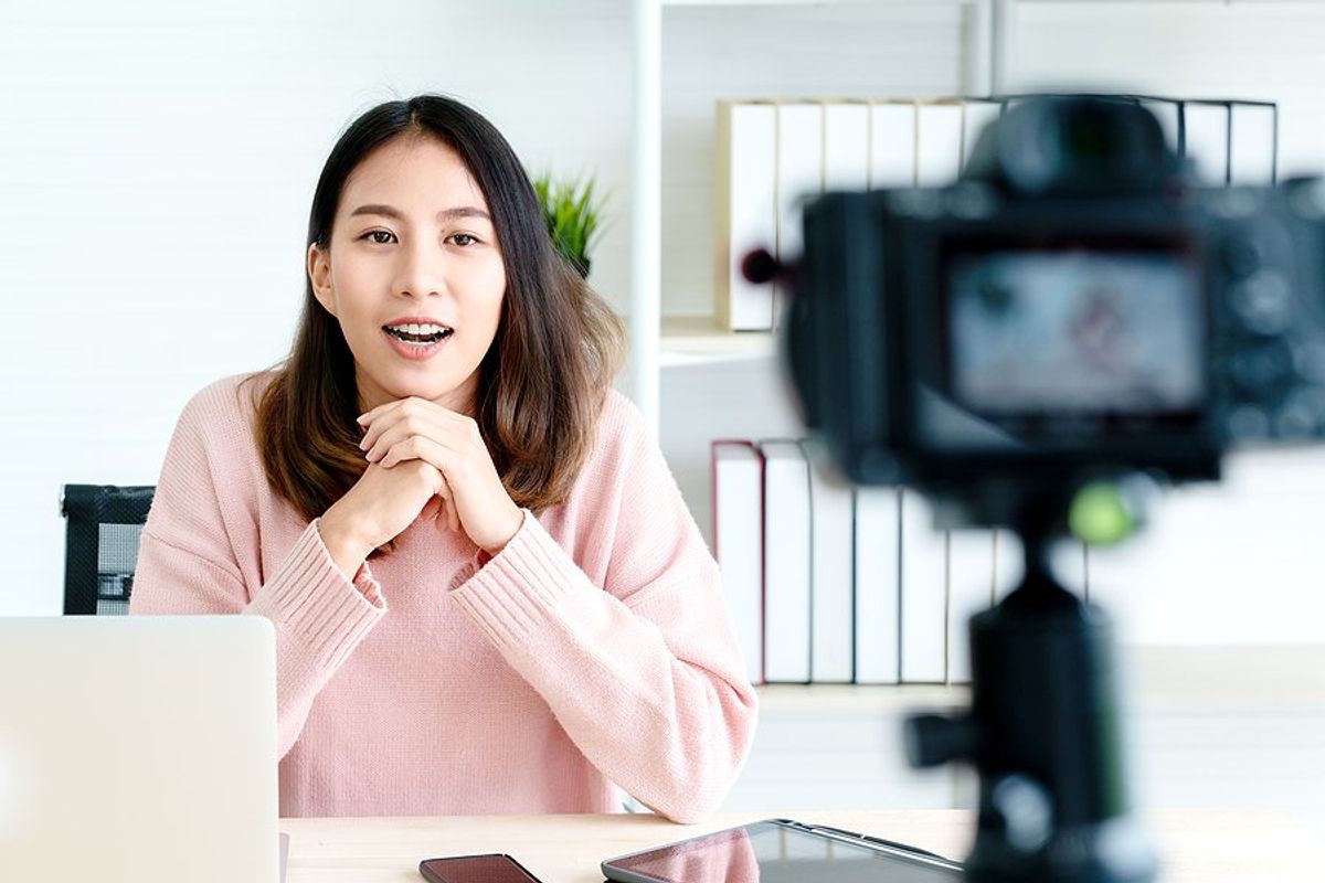 Professional woman records a video to post on LinkedIn