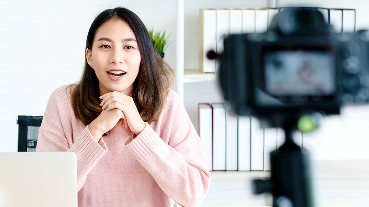 Professional woman records a video to post on LinkedIn