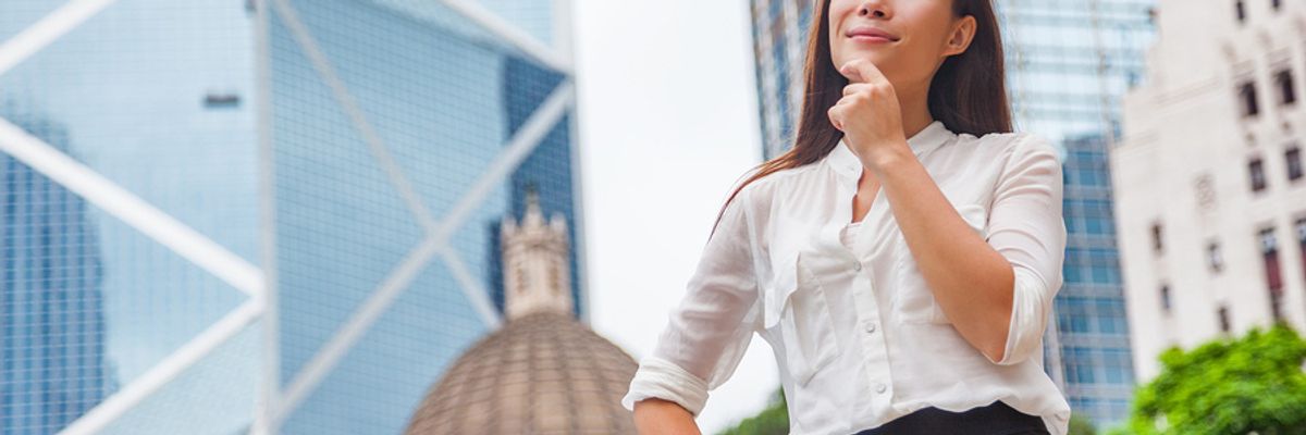 Professional woman thinking about the tips to setting achievable career goals