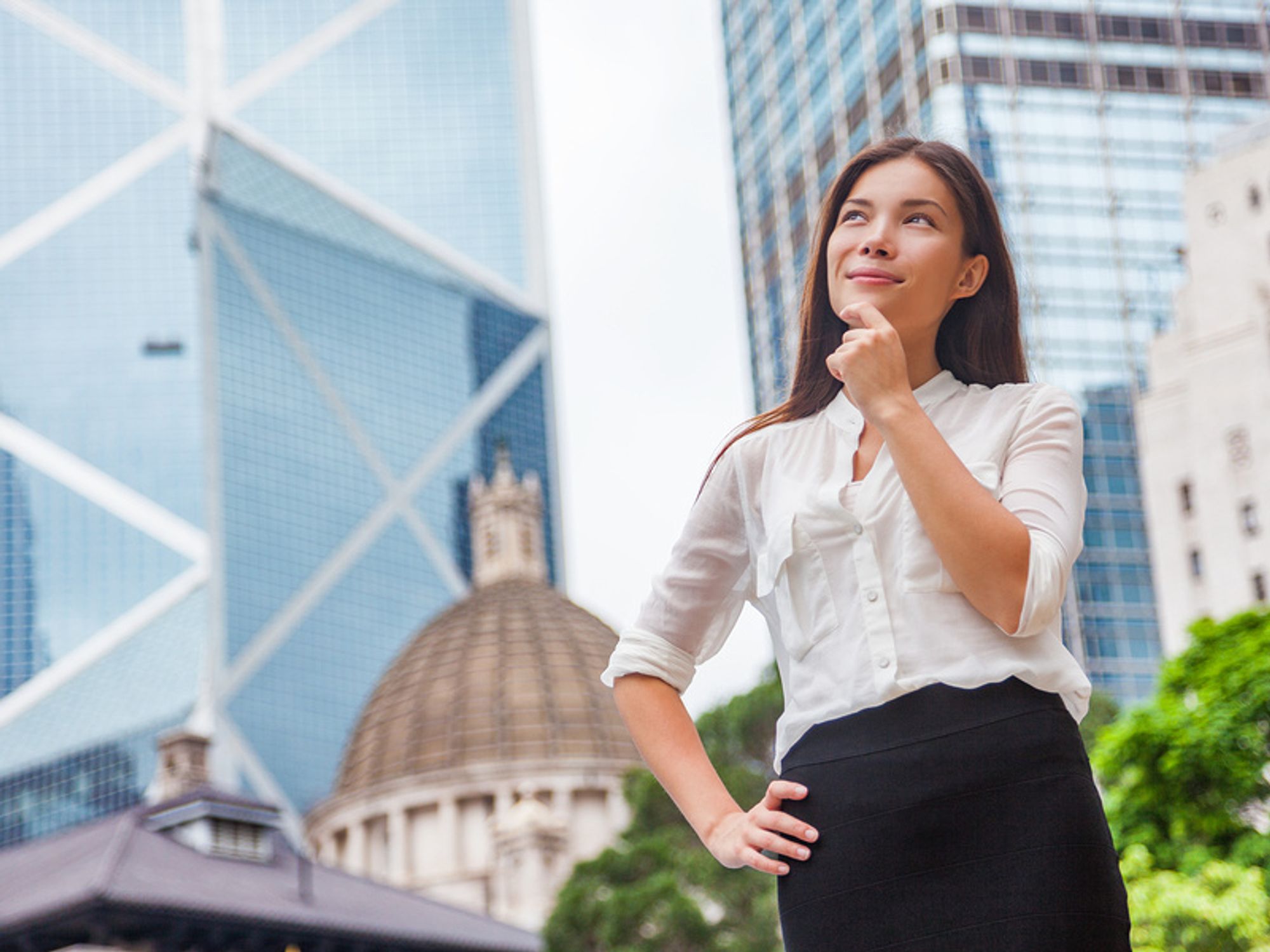 Professional woman thinking about the tips to setting achievable career goals