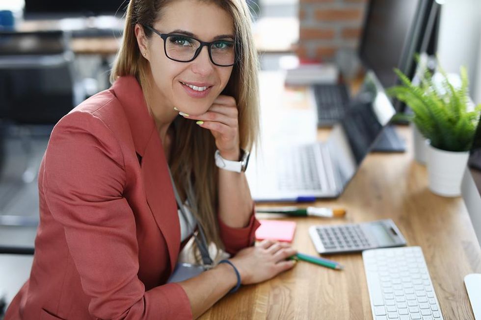 https://www.workitdaily.com/media-library/professional-woman-wearing-a-pink-blazer.jpg?id=25872660&width=980