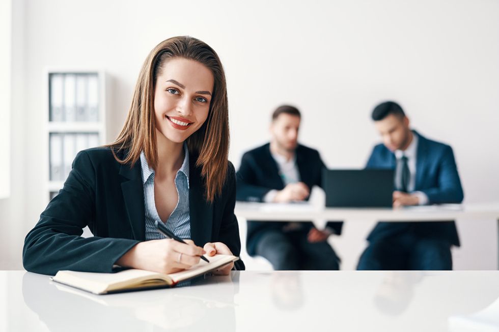 Professional woman working on developing her leadership skills in the office.