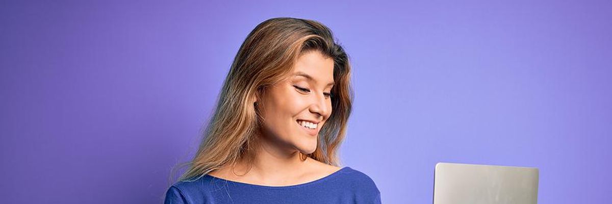 Professional woman works remotely for a company that pays for her vacation