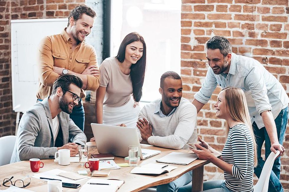 Professionals/coworkers network during a meeting