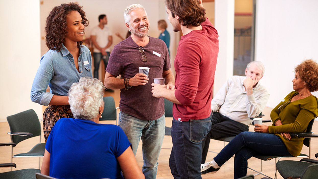 Professionals have a conversation during a networking event
