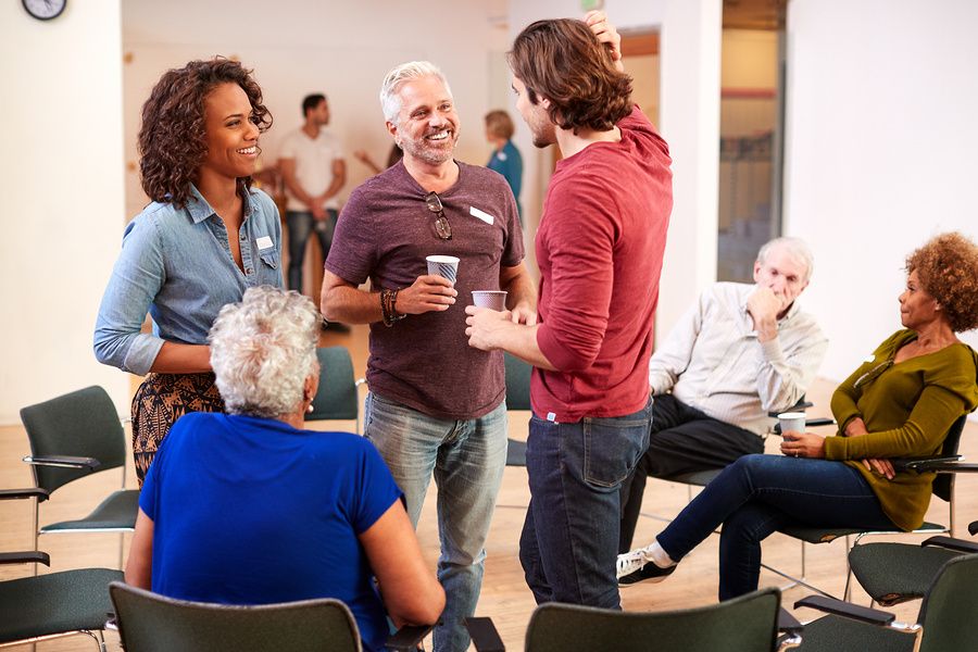 Professionals have a conversation during a networking event