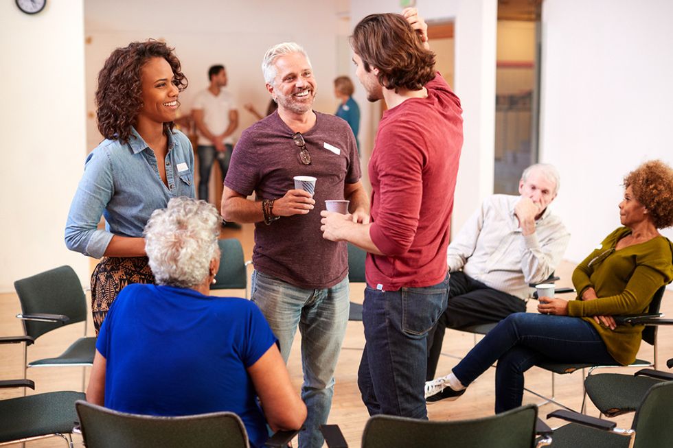 Professionals have a conversation during a networking event