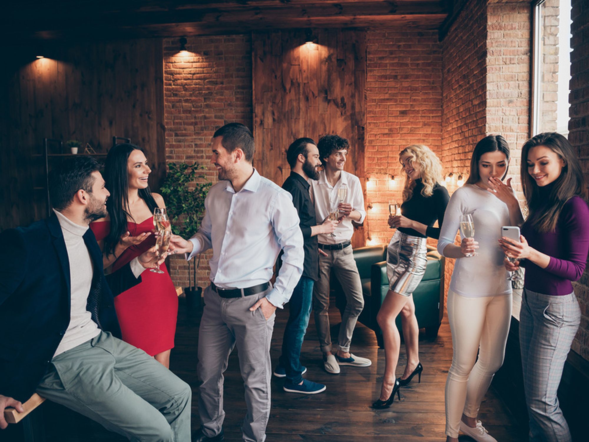 Professionals networking at a holiday work party