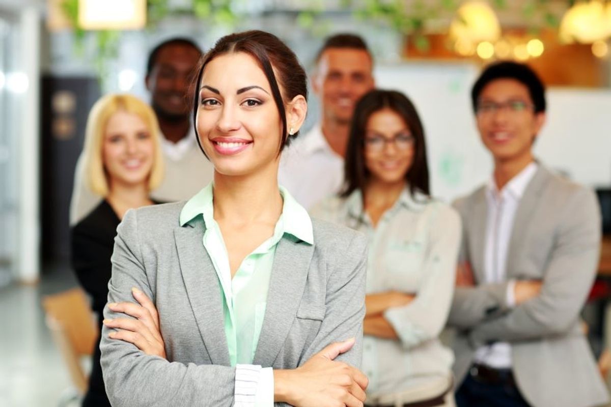 Professionals smiling because they get The Daily Dose newsletter, which is filled with free career tips!