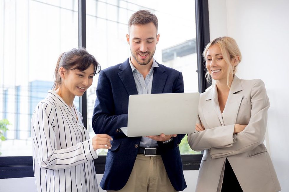 Project manager acts as a leader on his team at work