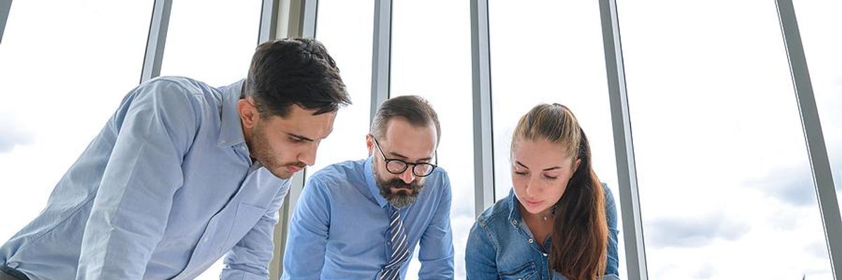 Project managers discuss a project execution plan