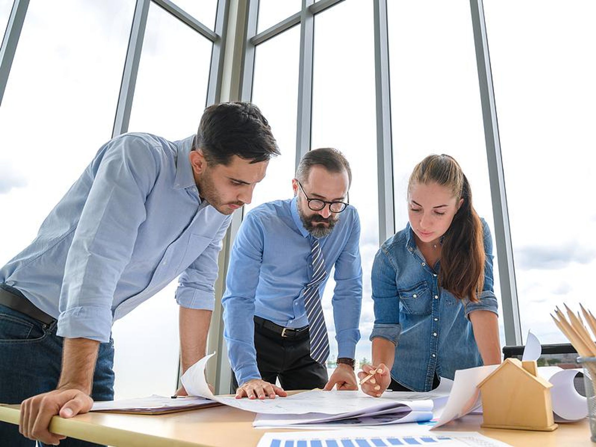 Project managers discuss a project execution plan