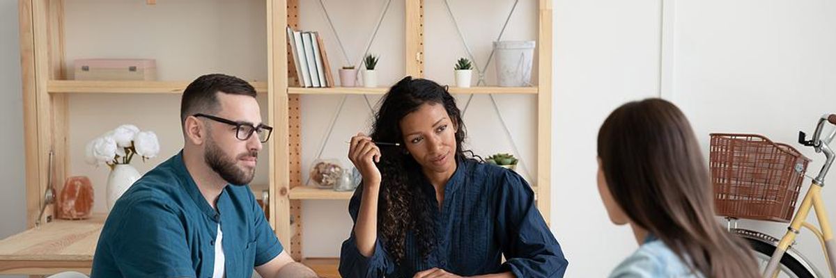 Recent college grad answers a question during a job interview