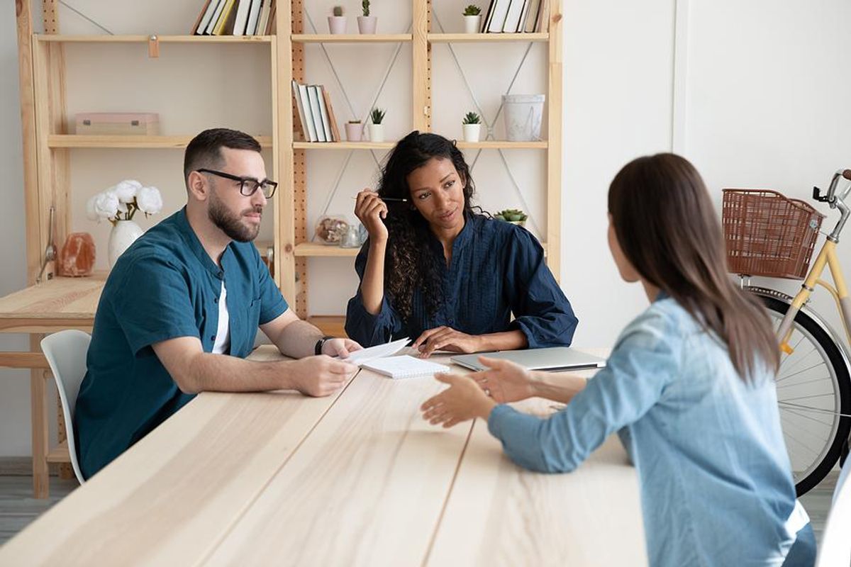 Recent college grad answers a question during a job interview