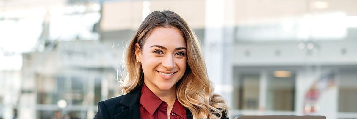 Recruiter / hiring manager holding laptop creates a job description
