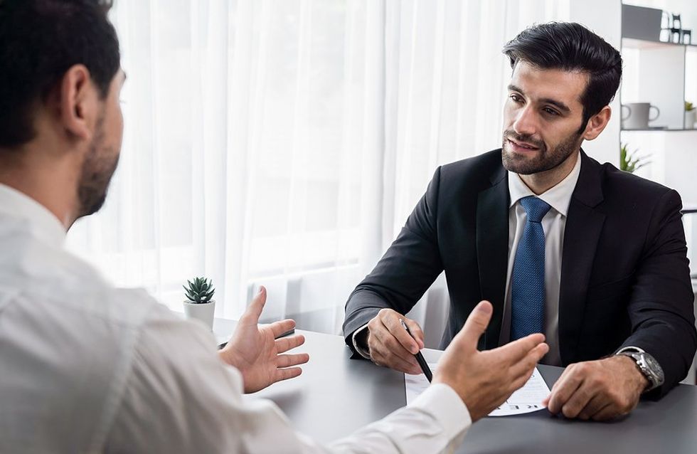 Recruiter/hiring manager talks to a job candidate during a job interview