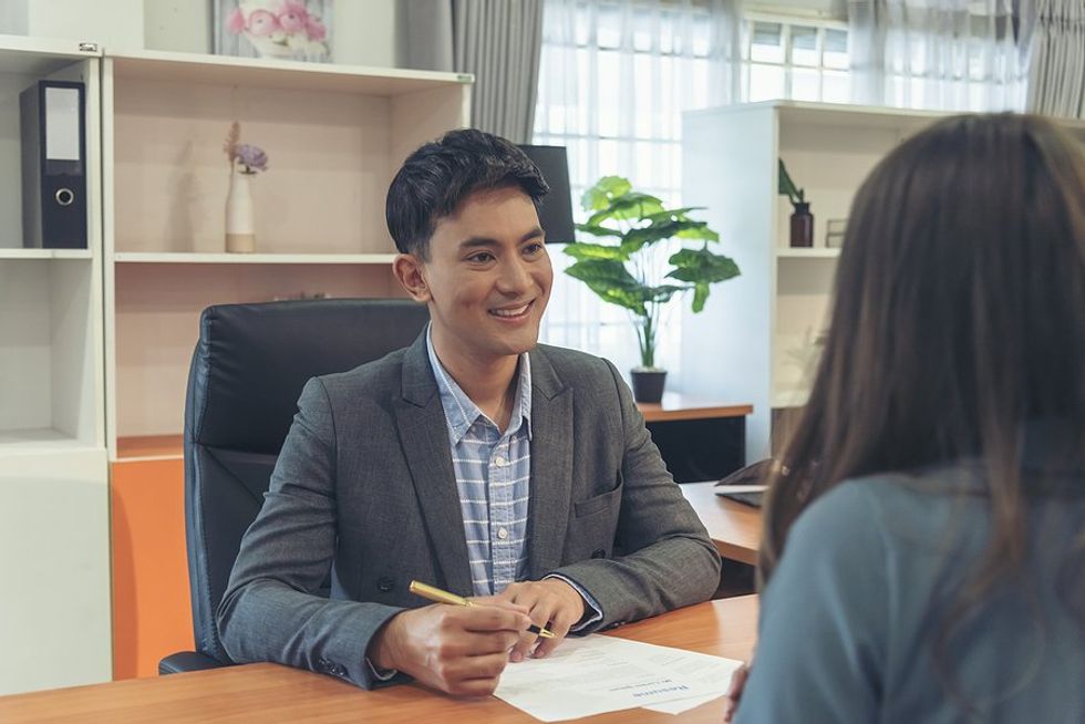 Recruiter / hiring manager talks to a job candidate during an interview