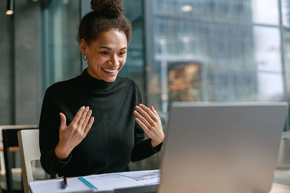 Recruiter / hiring manager utilizes storytelling while talking to a job candidate on her laptop