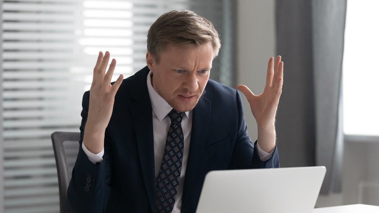 Recruiter on laptop feeling frustrated after reading common cover letter mistakes