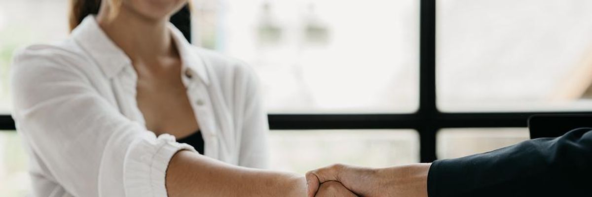 Recruiter shakes hands with a job candidate