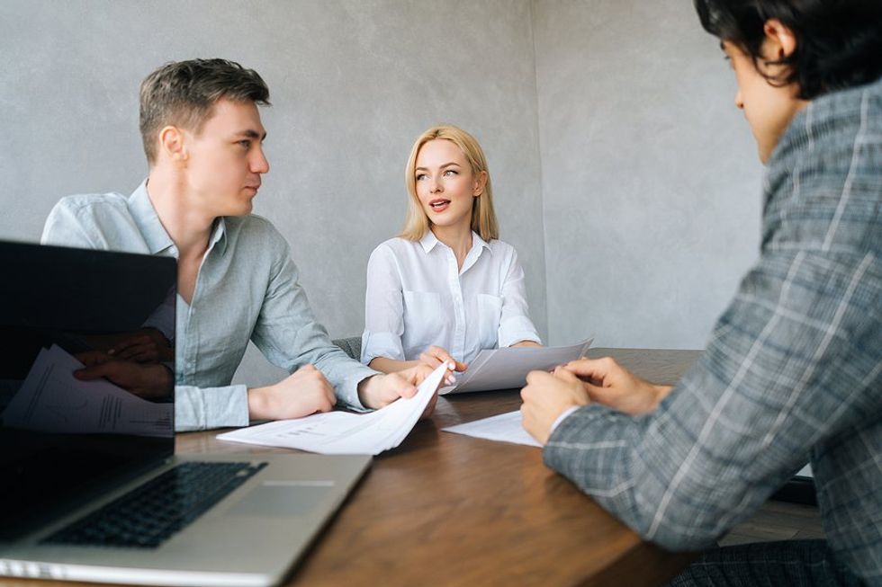 Recruiters / hiring managers talk to a job candidate during an interview