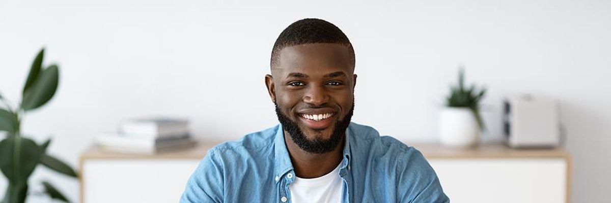 Remote worker smiling at camera