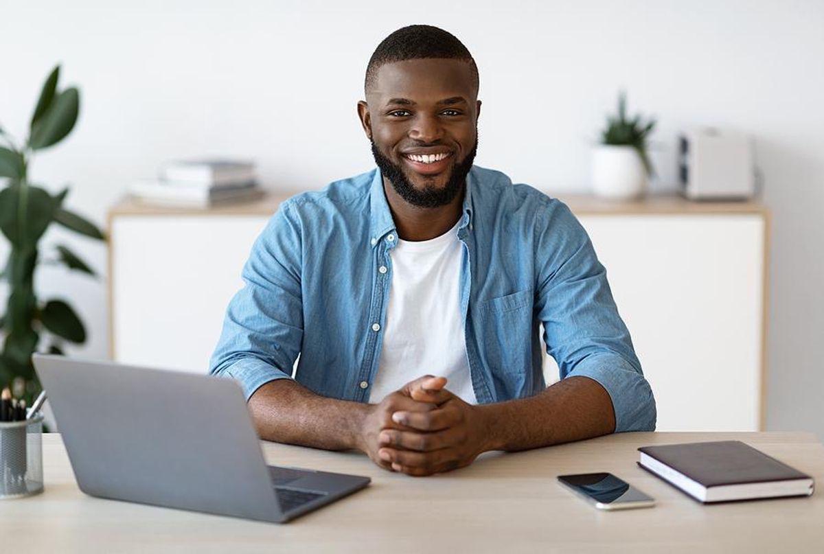 Remote worker smiling at camera