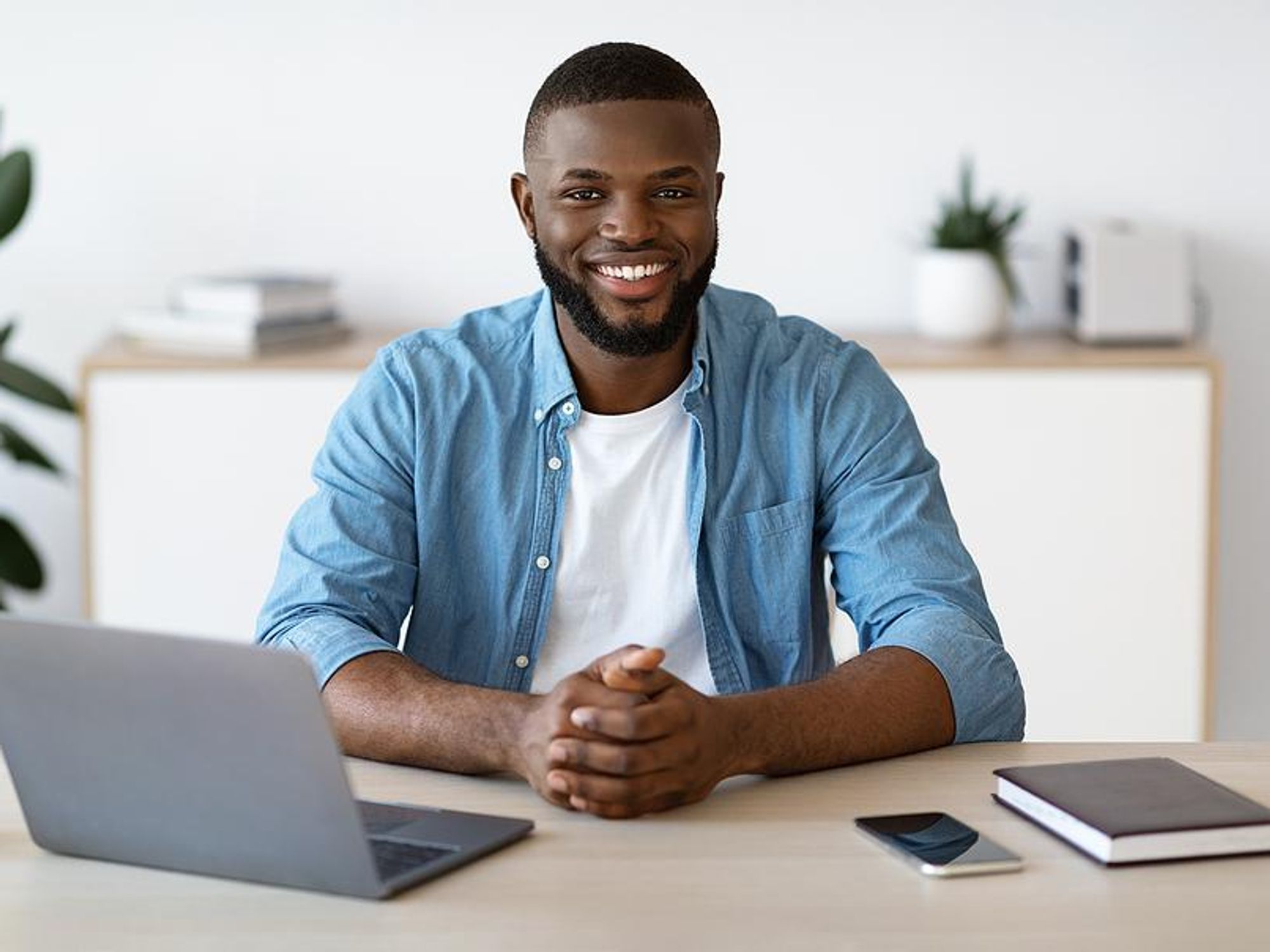 Remote worker smiling at camera