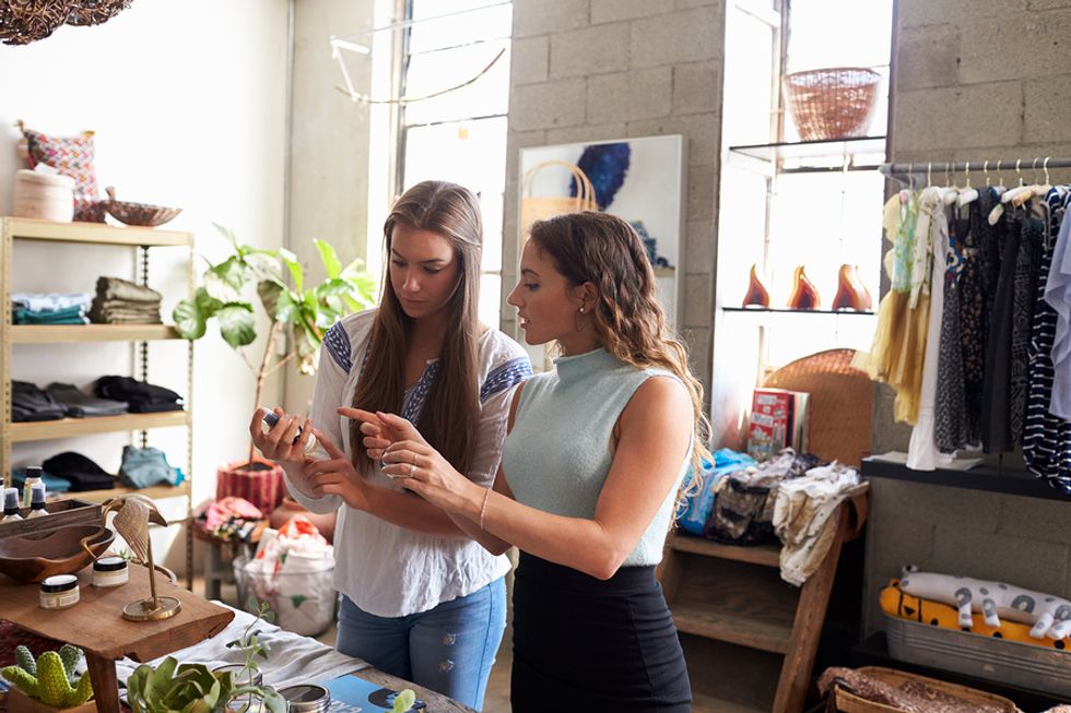 Retail manager uses her customer service skills at work