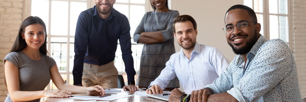 Sales team smiling at the camera