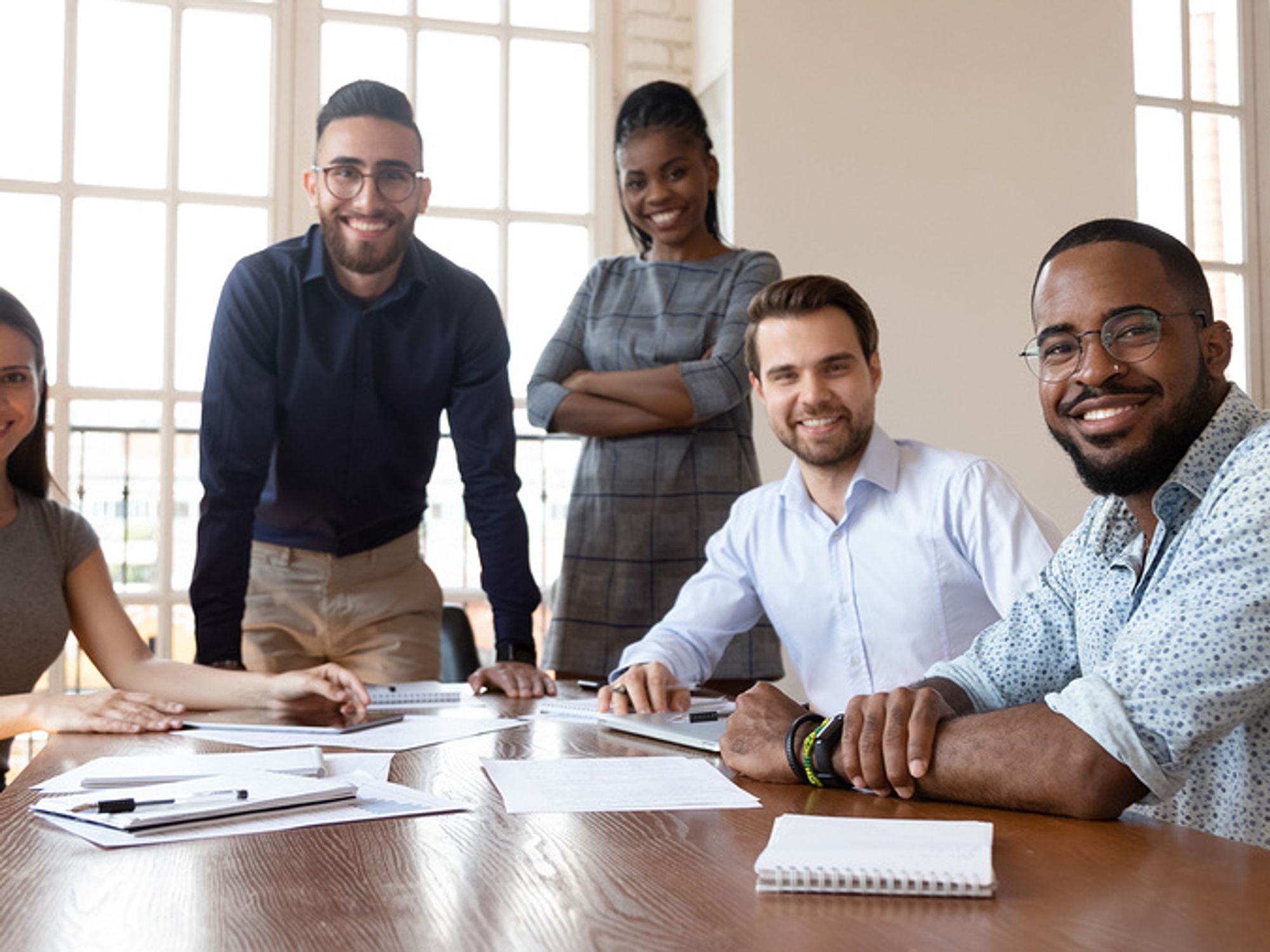 Sales team smiling at the camera