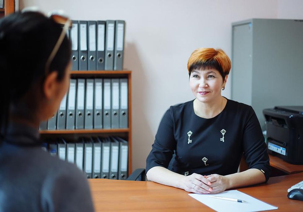 School principal talks to a teacher