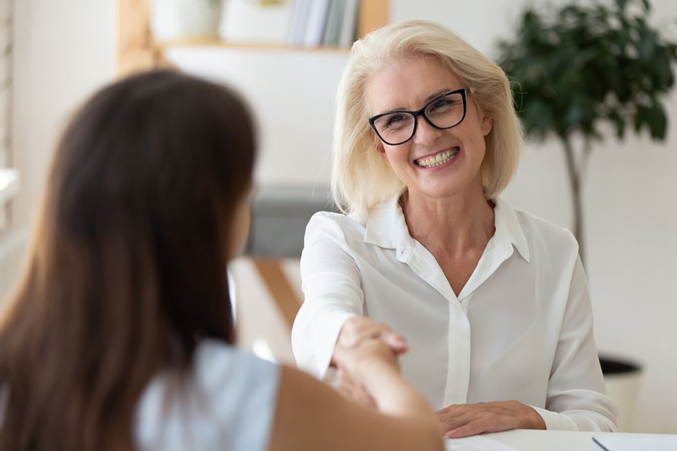 Seasoned professional shakes the interviewer's hand before a job interview