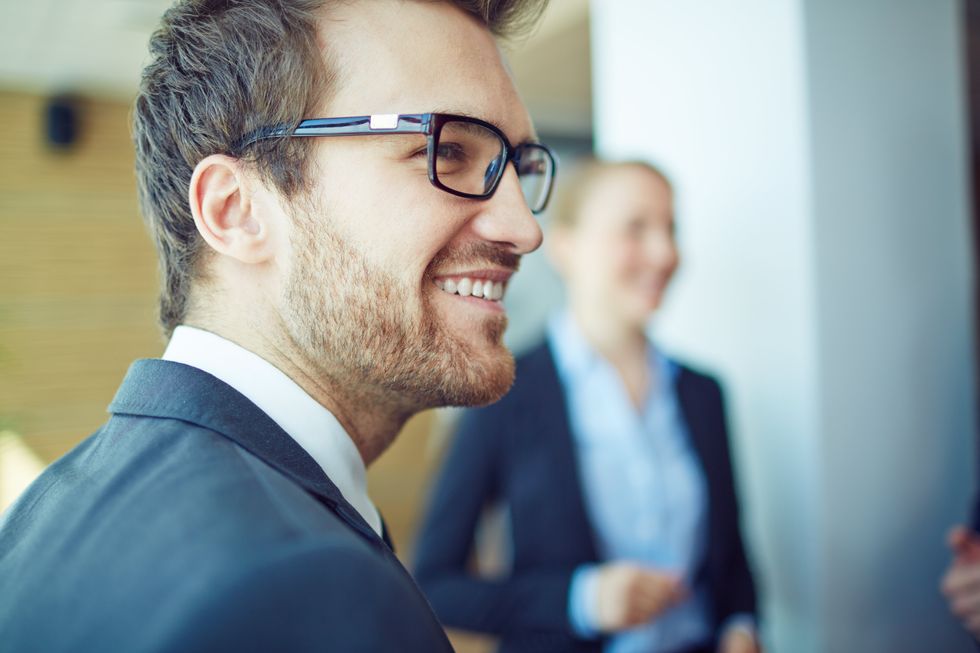 Smiling man owning his career experiences