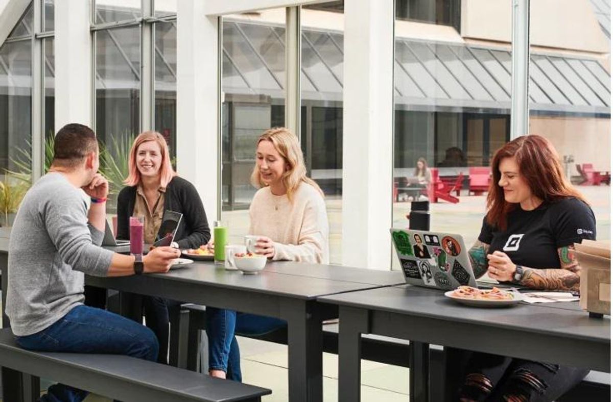 Square employees grab a bite to eat while working.